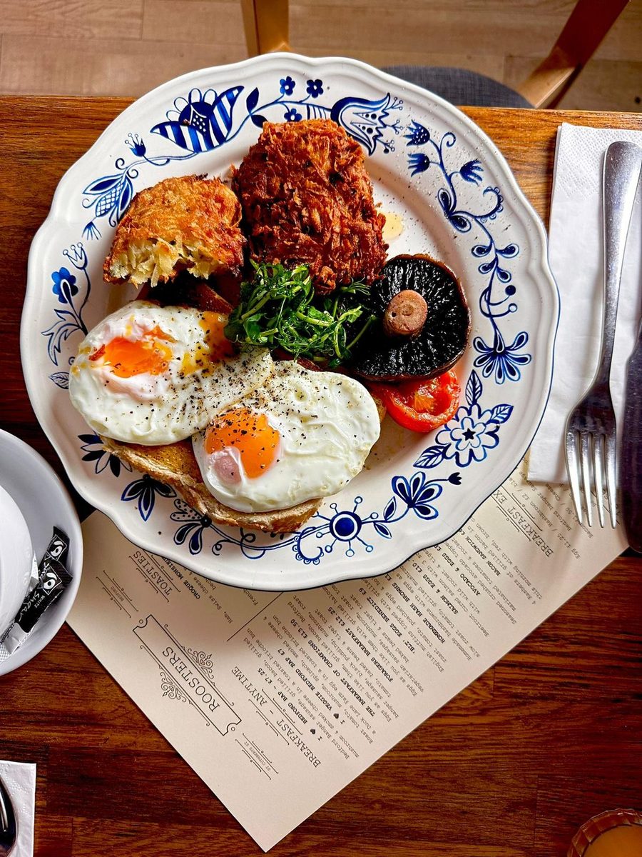 Hashbrowns, eggs and mushroom on Roosters’ blue and white china, sat on the Roosters menu